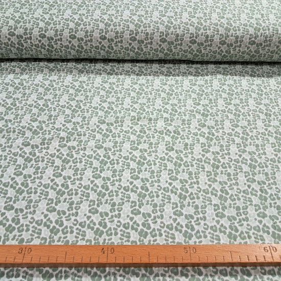 Double Gauze Animal Print fabric - Double gauze or two-layer muslin cotton fabric with green animal print designs on a white background. The fabric is 135cm wide and is made from 100% cotton.