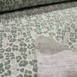 Double Gauze Animal Print fabric - Double gauze or two-layer muslin cotton fabric with green animal print designs on a white background. The fabric is 135cm wide and is made from 100% cotton.