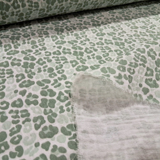 Double Gauze Animal Print fabric - Double gauze or two-layer muslin cotton fabric with green animal print designs on a white background. The fabric is 135cm wide and is made from 100% cotton.