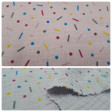 Double Gauze Confetti fabric - Cotton double gauze / muslin fabric with colorful confetti drawings, widely used in childcare and light clothing. The fabric is 135cm wide and its composition is 100% cotton.