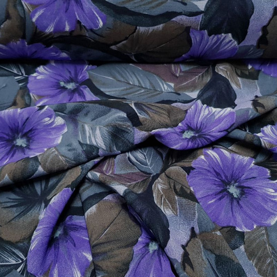Viscosilla Flowers Lilacs Gray Brown fabric - Viscosilla fabric printed with drawings of flowers and large leaves, where lilac, gray and brown colors predominate. The fabric is 150cm wide and its composition is 100% fibranne.