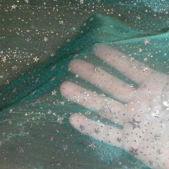 Tela Organza Fantasía - Tejido semi transparente de organza en color verde mar / turquesa con dibujos de estrellas plateadas con puntos de purpurina plateada. Tela disfraz Frozen