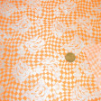 OUTLET Carnival Satin Harlequin fabric - Carnival satin fabric with fluorescent orange rhombuses. Ideal for flashy costumes, harlequin type. 