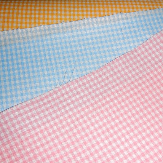 Gingham Polycotton Small Size fabric - Gingham fabric is widely used in table linens, decorative clothing, curtains, nursery school gowns and other crafts. The square measures 2.5mm The fabric is 160cm wide and its composition is 70% polyester - 30% cotto